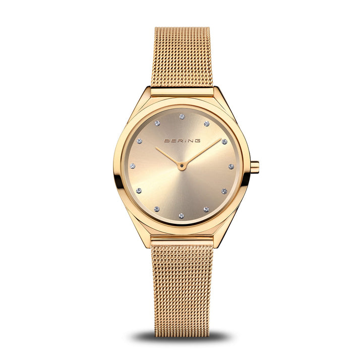 Berings 17031-333 dameshorloge heeft een minimalistisch design met een mesh band en een ronde wijzerplaat. Het heeft een subtiele gouden wijzerplaat, beschermd door saffierglas, versierd met kleine kristallen markeringen op elk uur en de merknaam elegant geplaatst onder de 12 uur markering.