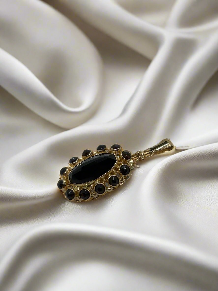 Vintage goldener Anhänger 14k mit ovalem Granat und schwarzen Steinen, 5,3 g