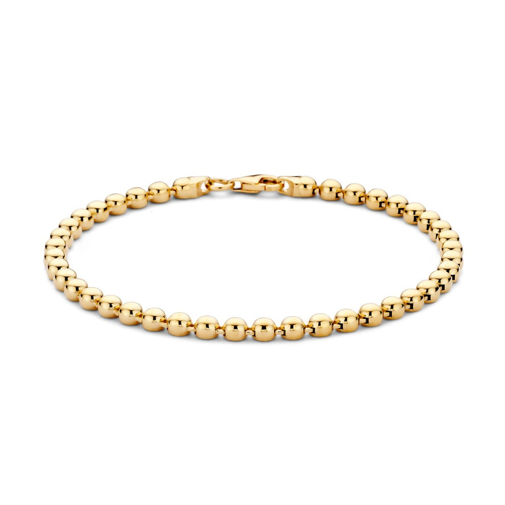 Softe, gelbgoldene Armband mit goldenen Kugeln in gleichmäßiger Anordnung