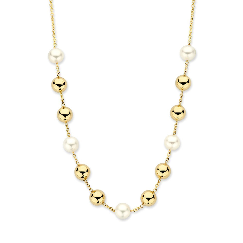 Gelbgoldenes Collier mit Perlen und goldenen Elementen aus 14 Karat Gold
