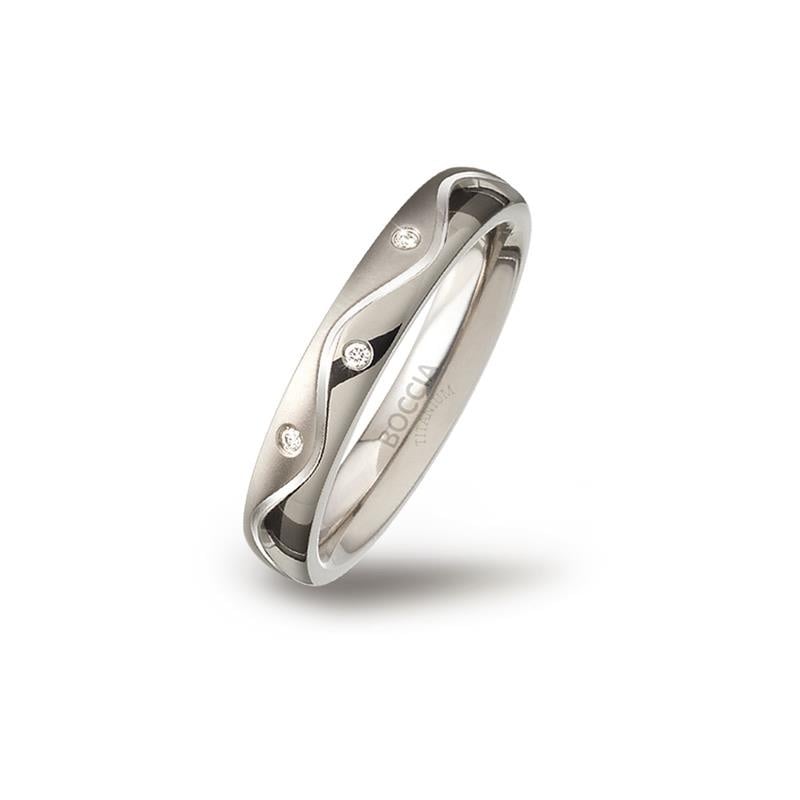 Titanring aus Titan mit gewelltem Design und drei kleinen, funkelnden Edelsteinen