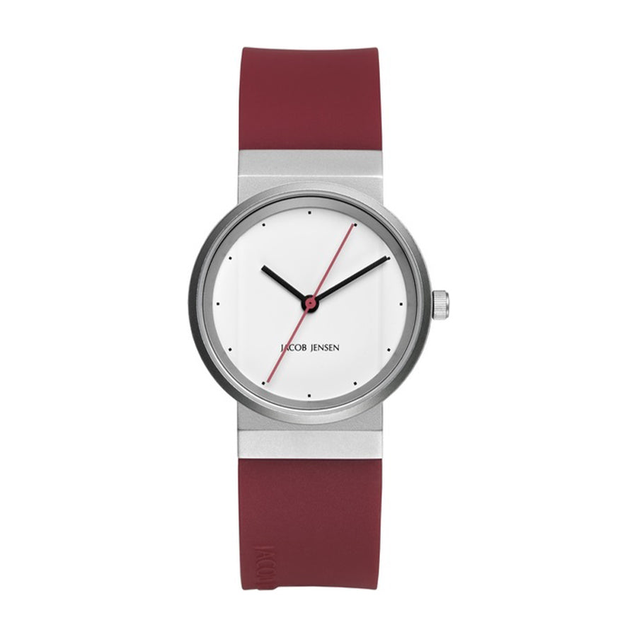 Uhr mit silbernem Gehäuse, weißem Zifferblatt und rotem Silikonarmband