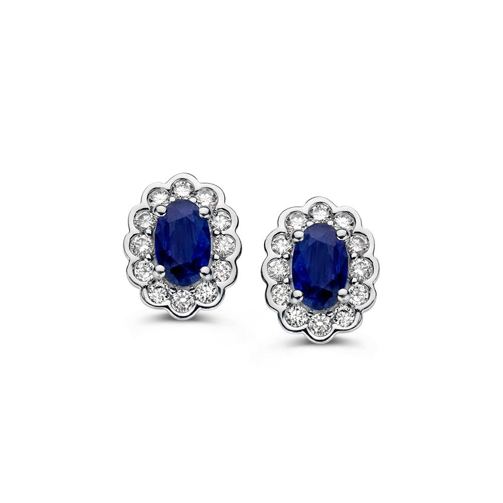 Ohrstecker aus Gelbgold mit ovalem Saphir und Diamanten in Entouragefassung