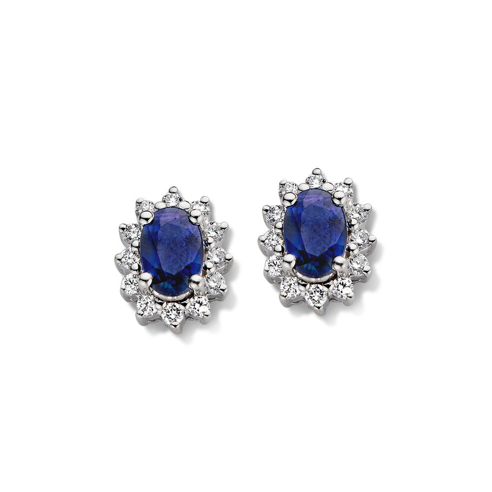 Ohrstecker aus Weißgold mit ovalem Saphir und Brillanten, umgeben von kleinen Diamanten