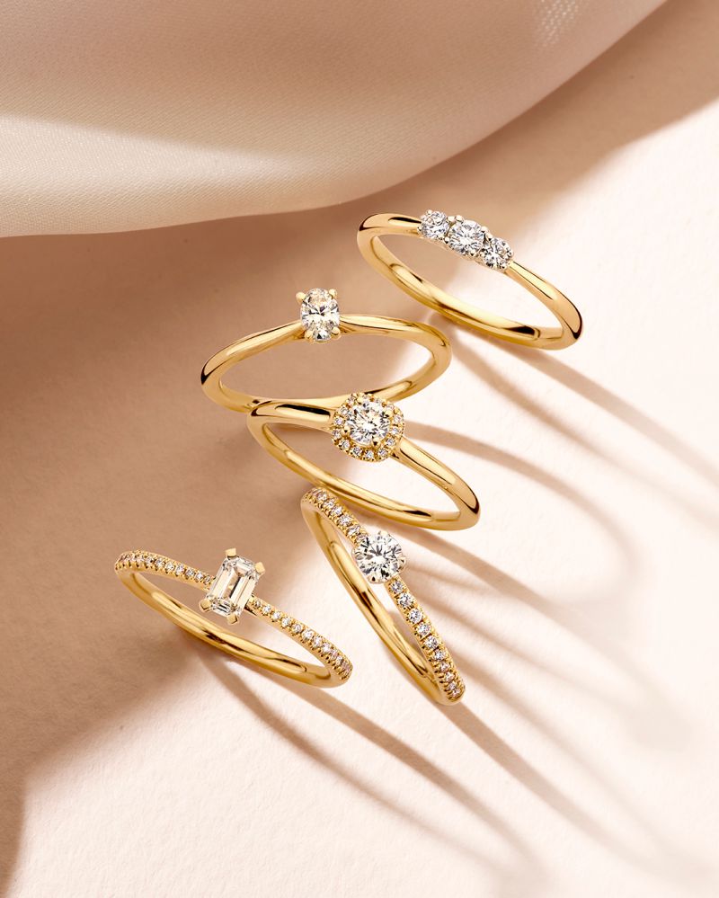 Eleganter Bicolor Dreisteinring mit Diamanten – 0,24 ct