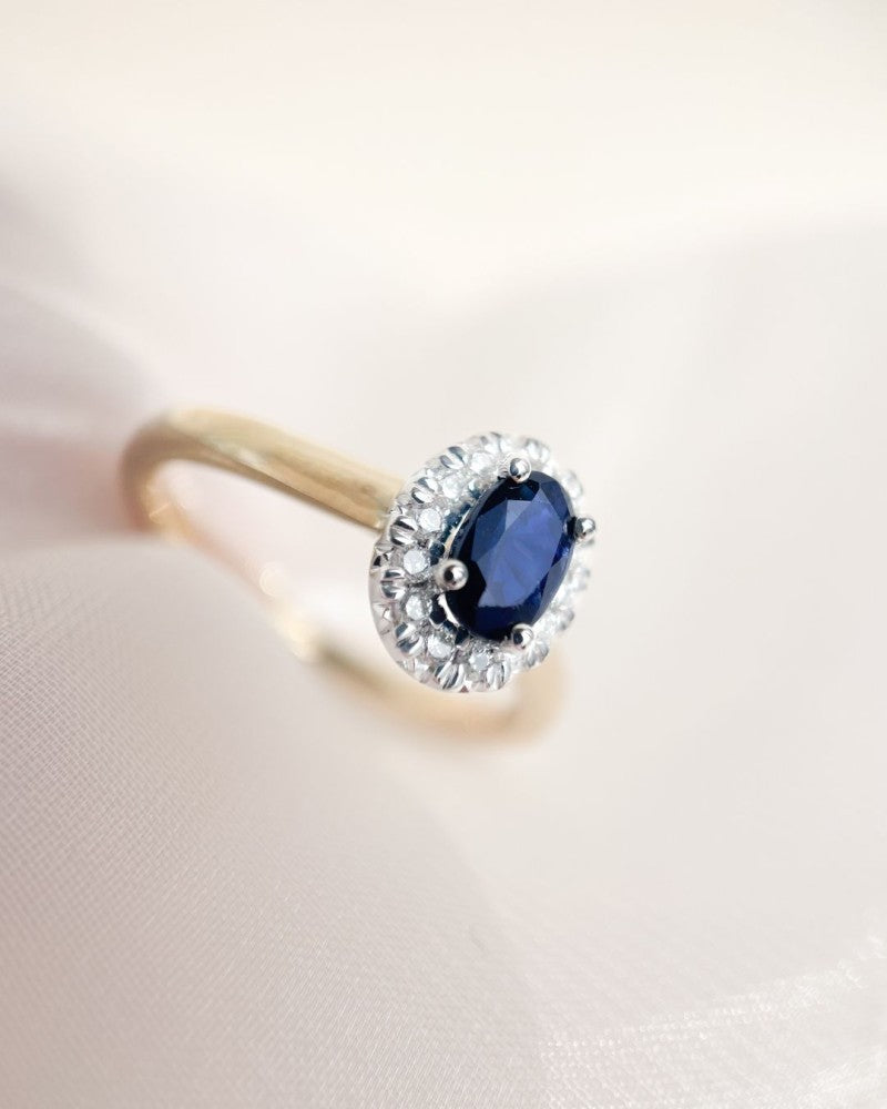 Damenring aus 14 Karat Gold mit blauem Saphir und Diamanten-Halo