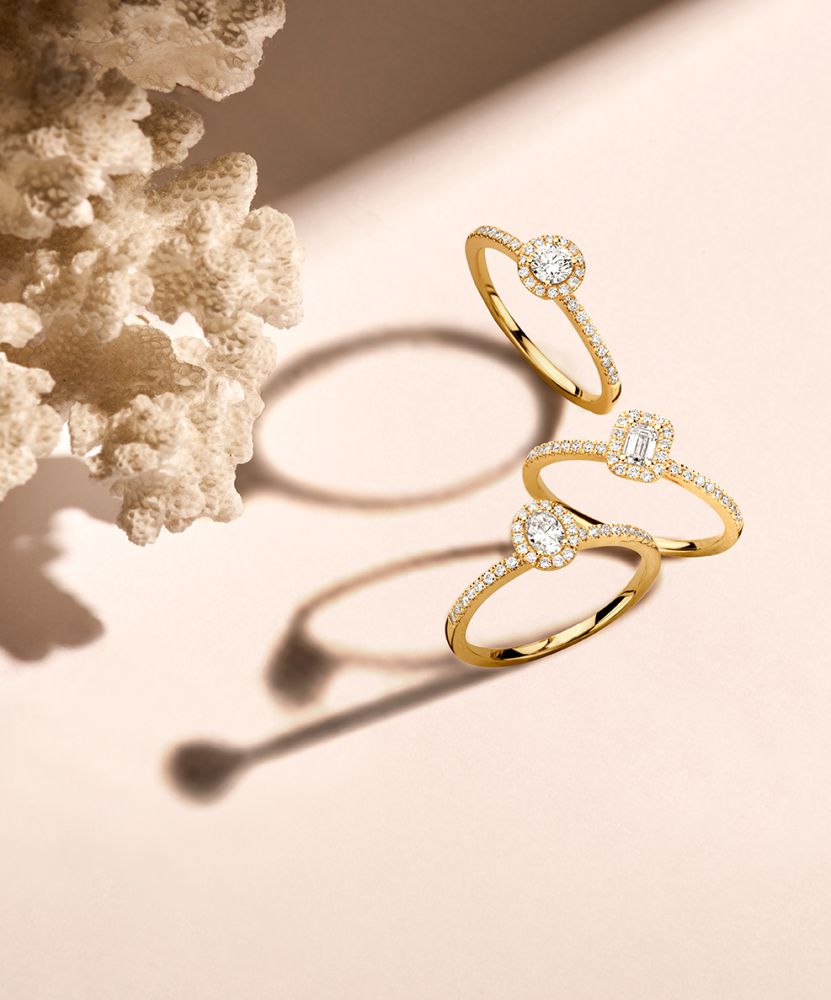 Eleganter Gelbgoldring mit 0,20 Karat Brillant und Diamant-Halo