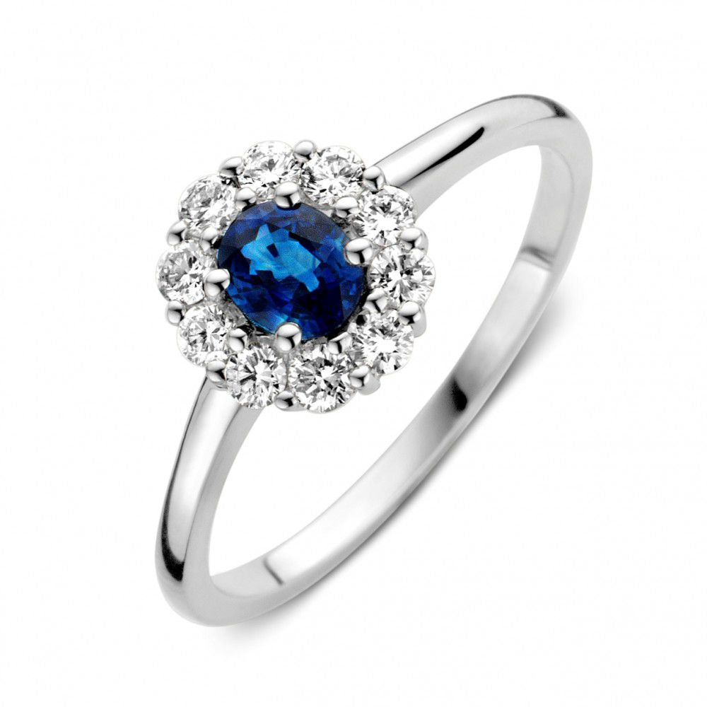Ring aus Weißgold mit blauem Saphir und Diamanten, runder Saphir umgeben von Diamanten