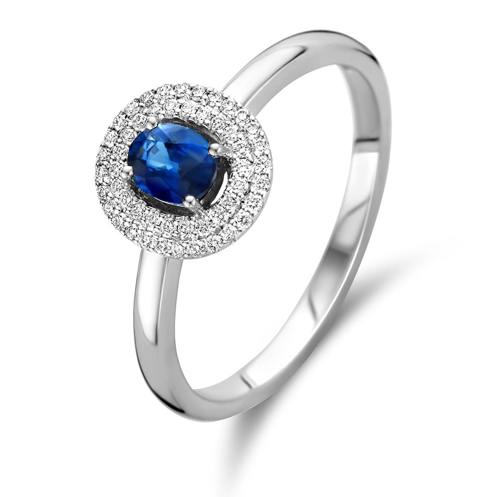 Ring aus Weißgold mit blauem Saphir und Brillanten im kreisförmigen Design