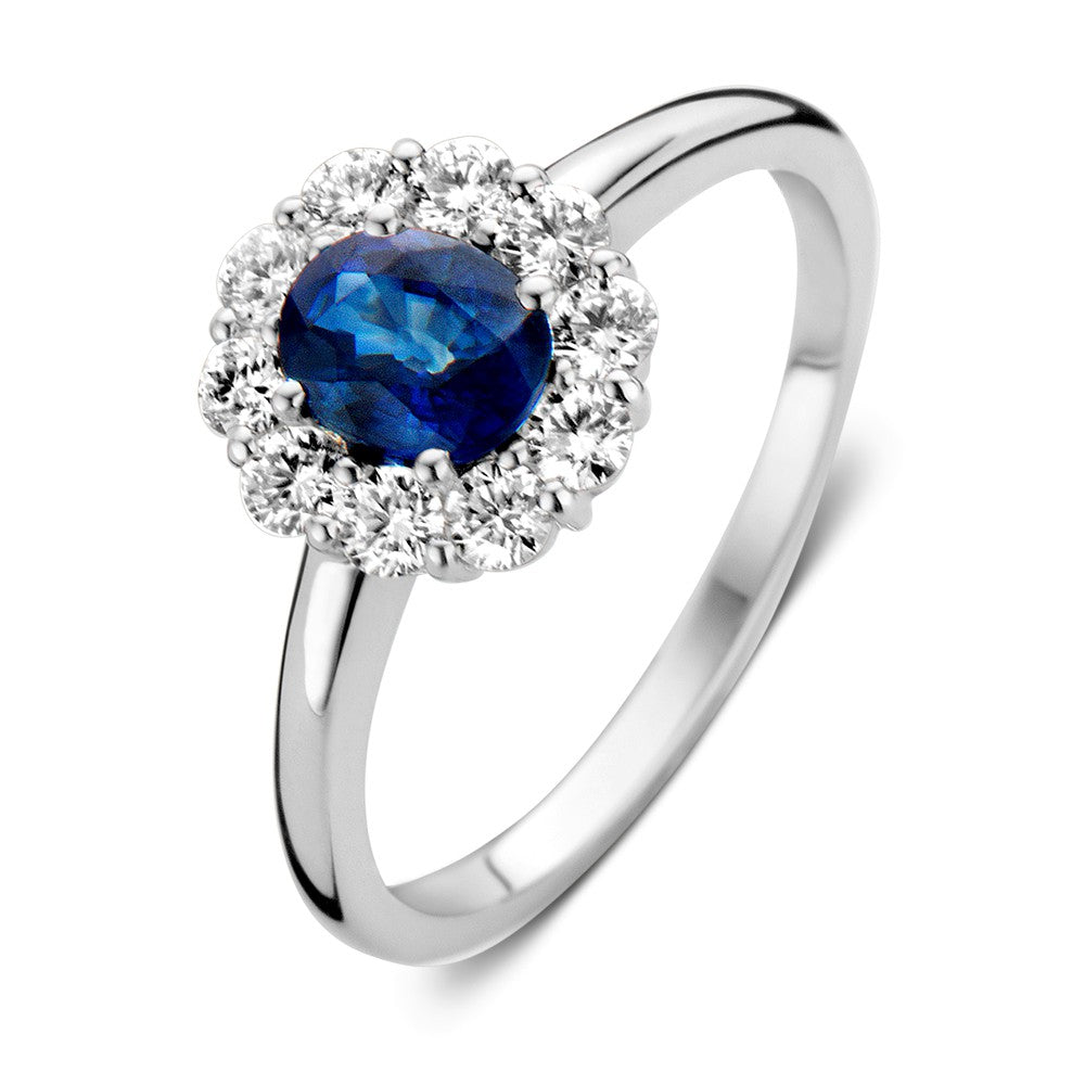 Ring aus Weißgold mit blauem Saphir und Diamanten, runde Form mit funkelndem Diamantenrand