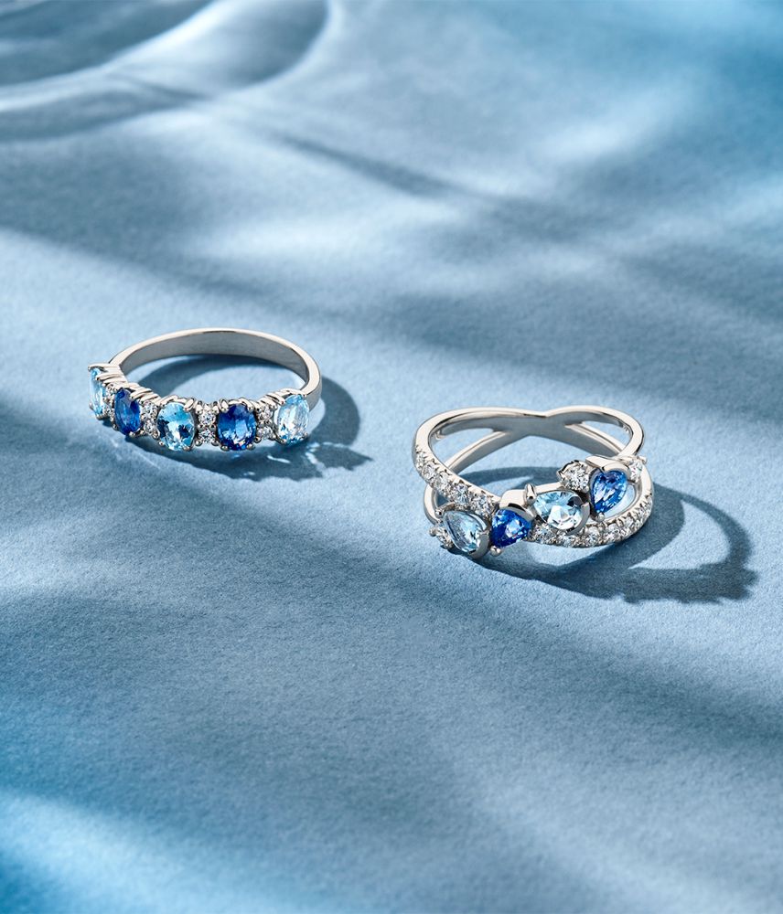 18kt Weißgoldring mit ovalen Saphiren, Aquamarinen und 0.12ct Brillanten