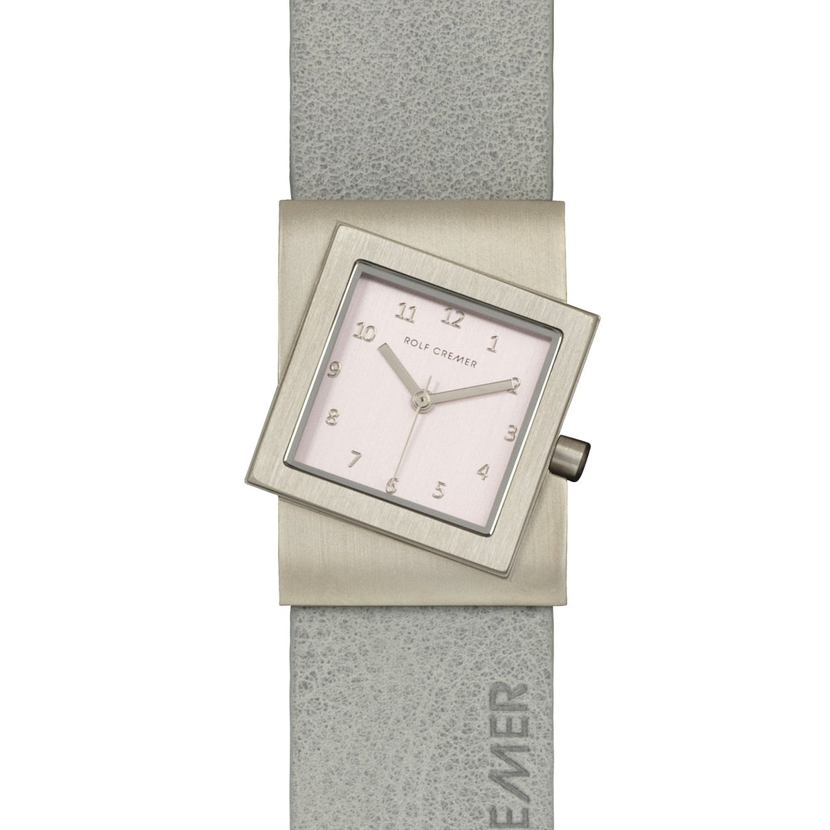 Quadratisches Rolf Cremer Uhr mit silbernem Gehäuse und grauem Lederarmband, das Zifferblatt ist hell mit arabischen Ziffern