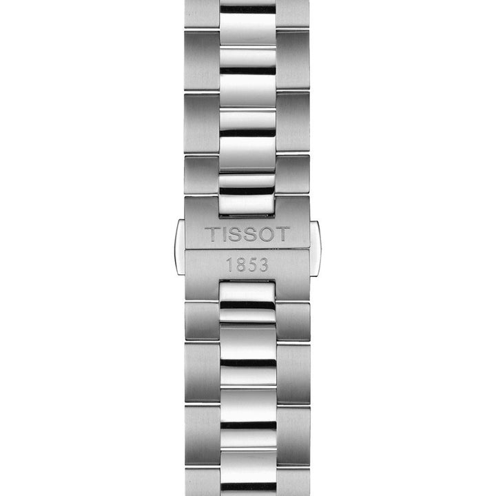 Close-up van een Tissot Gentleman Powermatic 80 Open Heart horlogeband van zilverkleurig roestvrijstaal met geborstelde en gepolijste schakels. De sluiting is gegraveerd met "TISSOT 1853", wat het erfgoed en het Zwitserse automatische prestige van het merk weerspiegelt.
