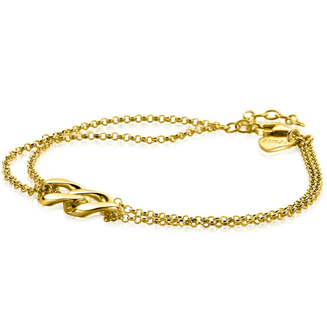 De Zinzi Armband Goud Verguld Zia2331 heeft een dubbel kettingontwerp met gourmetschakels, een hartvormig bedeltje bij de sluiting en is verbonden met drie in elkaar verstrengelde lussen in het midden.