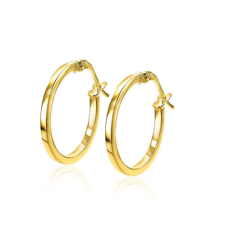 Ohrringe aus Gold mit glänzender Oberfläche in runder Form