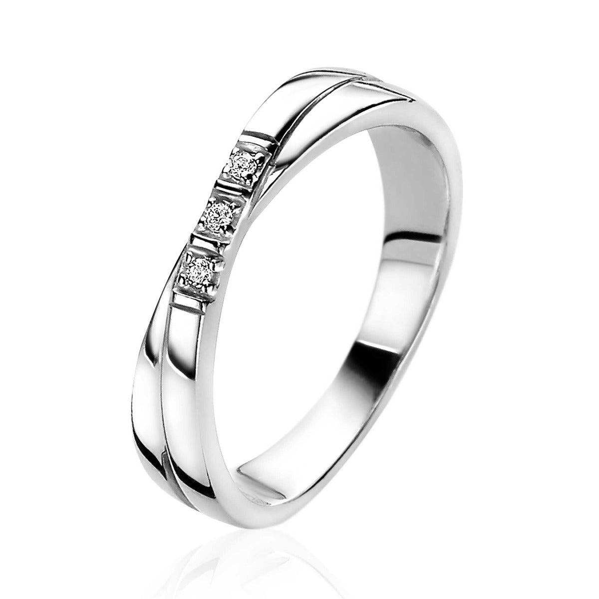 Ring aus Silber mit drei kleinen Edelsteinen und geschwungener Oberfläche